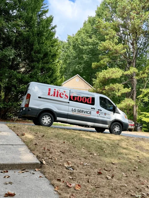 TAS service van displaying LG-authorized service branding